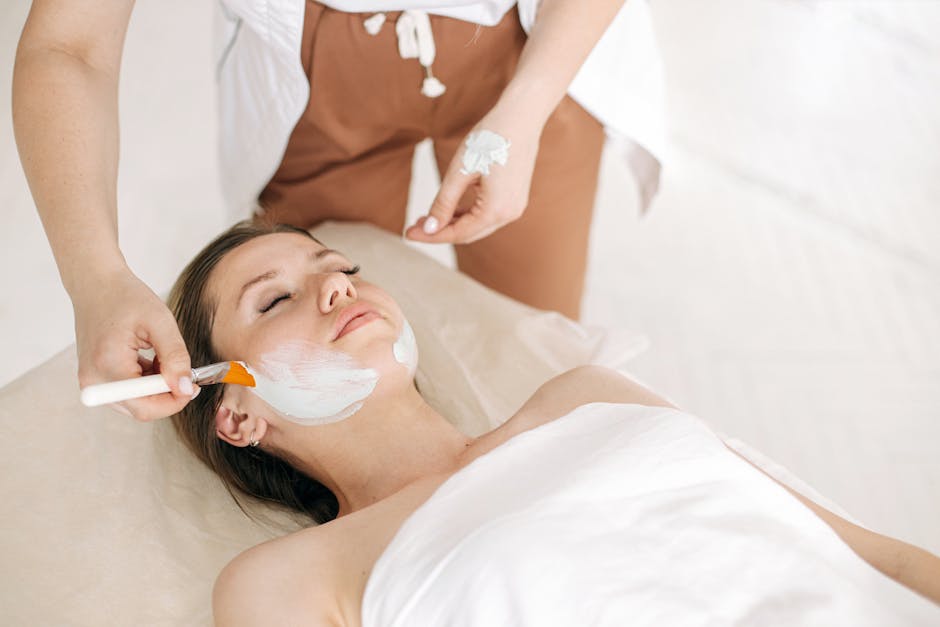 Woman receiving a rejuvenating facial treatment at a spa, promoting skin care and relaxation